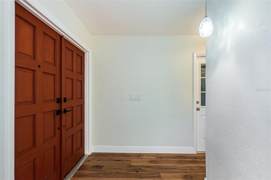 4723 114th Street North Madeira Beach, FL 33708 - Photo 7 of 41 wooden floor in an empty room