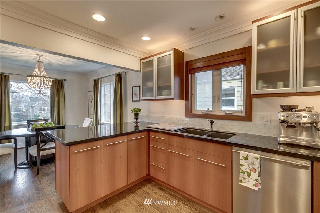 2565 35th Avenue West Seattle, WA 98199 - Photo 11 of 36 a kitchen with granite countertop a sink and a stove