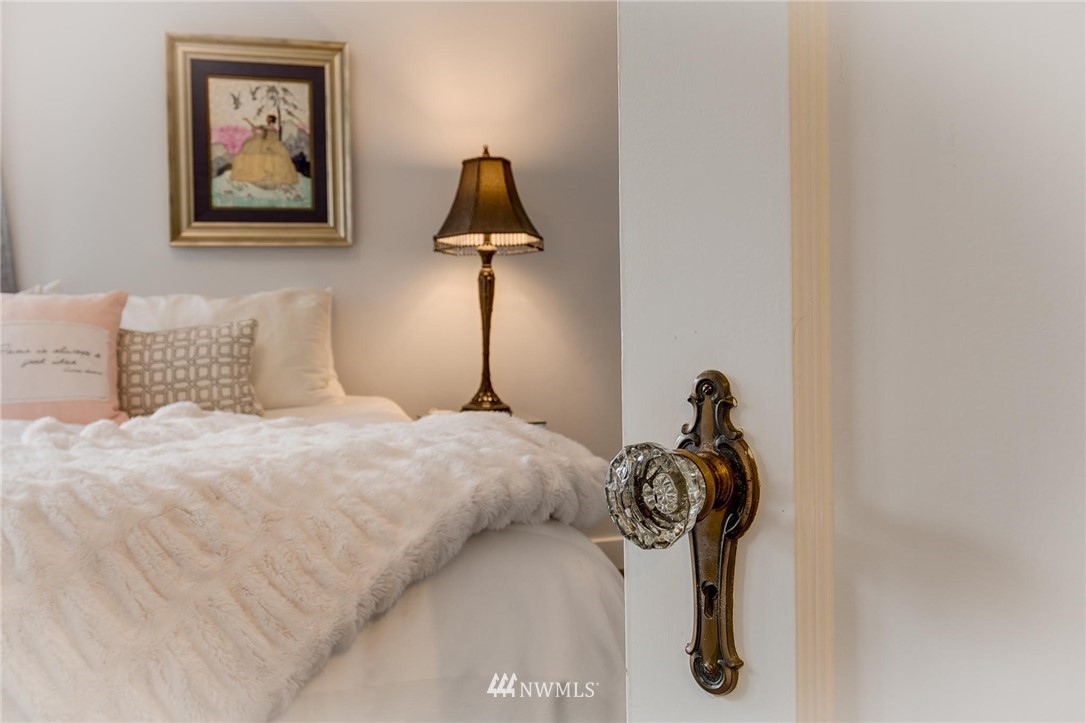 2565 35th Avenue West Seattle, WA 98199 - Photo 15 of 36 a bedroom with a bed and a painting on the wall