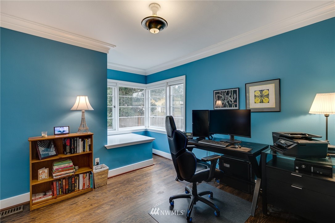 2565 35th Avenue West Seattle, WA 98199 - Photo 19 of 36 a view of a workspace with furniture and a window