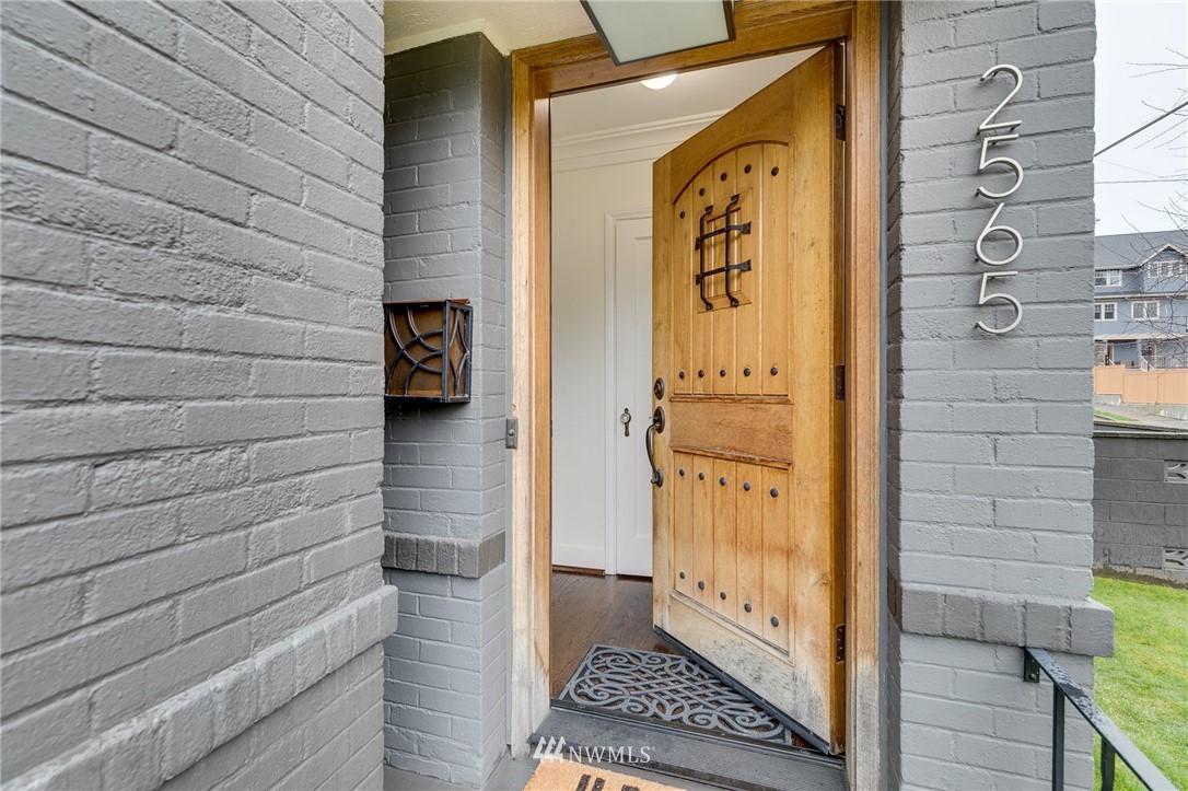 2565 35th Avenue West Seattle, WA 98199 - Photo 2 of 36 a view of a door and wooden floor