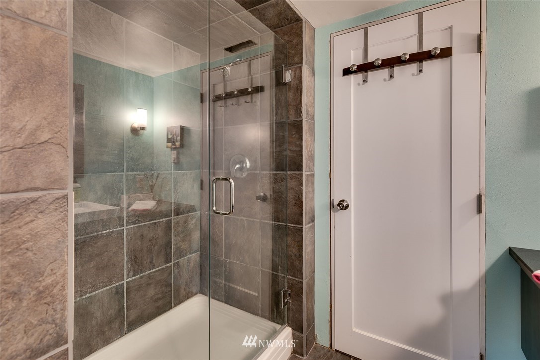 2565 35th Avenue West Seattle, WA 98199 - Photo 25 of 36 a bathroom with a shower