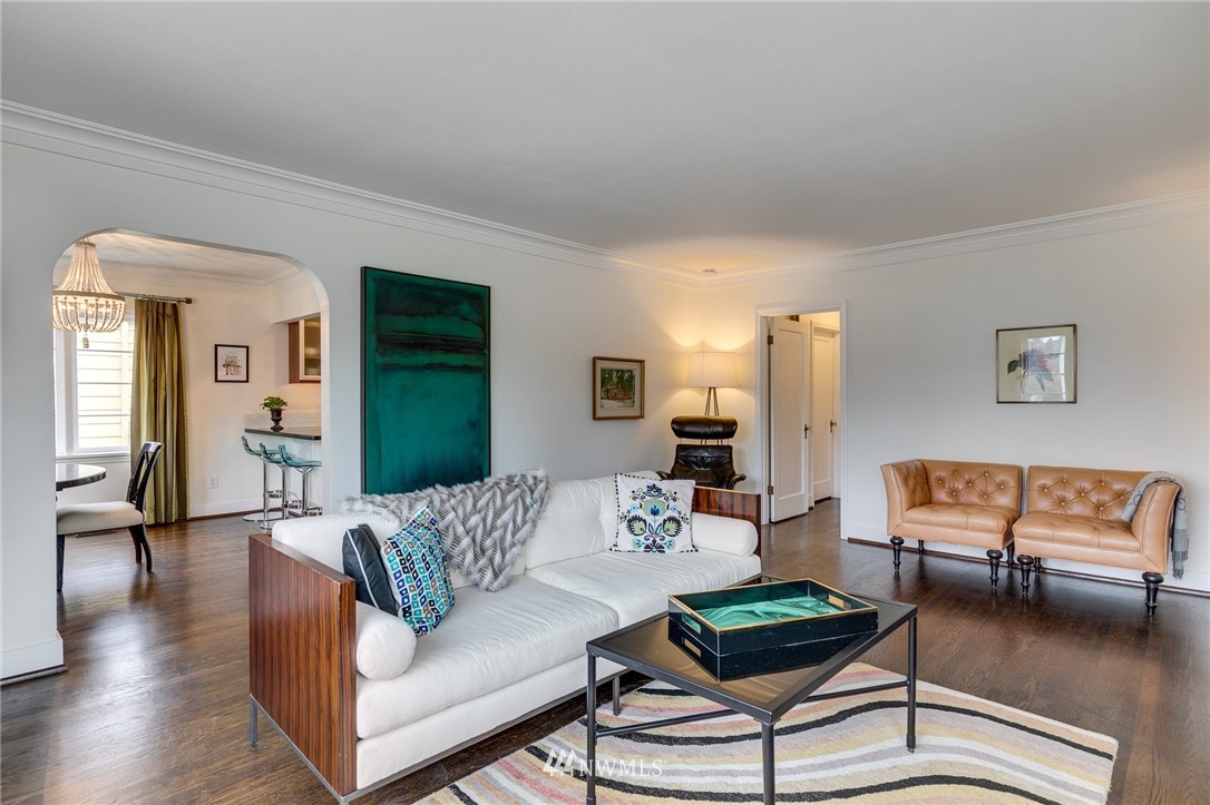 2565 35th Avenue West Seattle, WA 98199 - Photo 5 of 36 a living room with furniture and a wooden floor