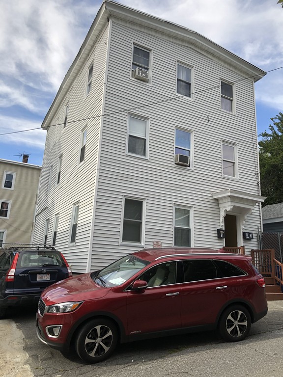 16 Prospect Court Lawrence, MA 01841 - Photo 1 of 14 a car parked in front of a house