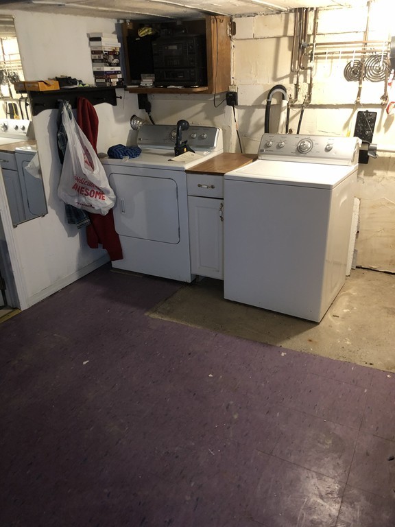 16 Prospect Court Lawrence, MA 01841 - Photo 13 of 14 a room with water heater and white walls
