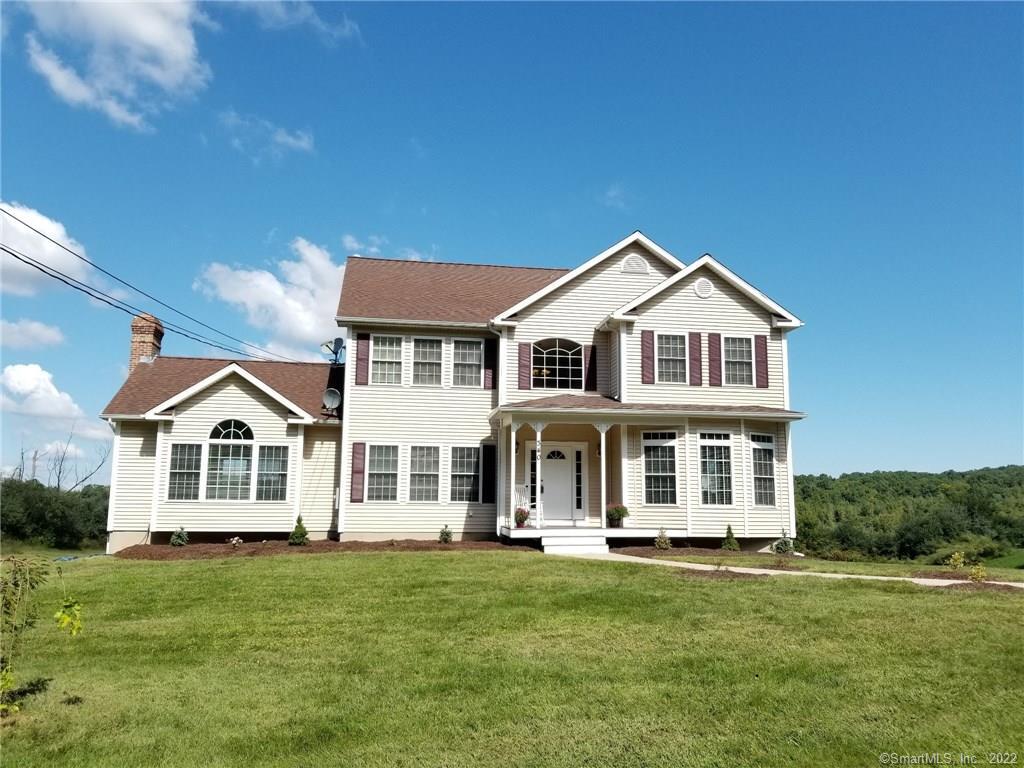 340 Falls Road Bethany, CT 06524 - Photo 1 of 1 a front view of a house with a garden