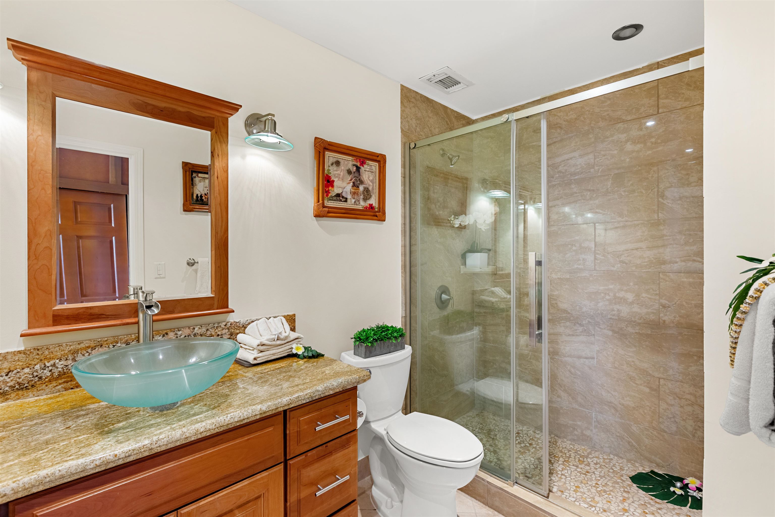 475 Front Street, Unit 635 Lahaina, HI 96761 - Photo 12 of 23 a bathroom with a granite countertop sink toilet and shower