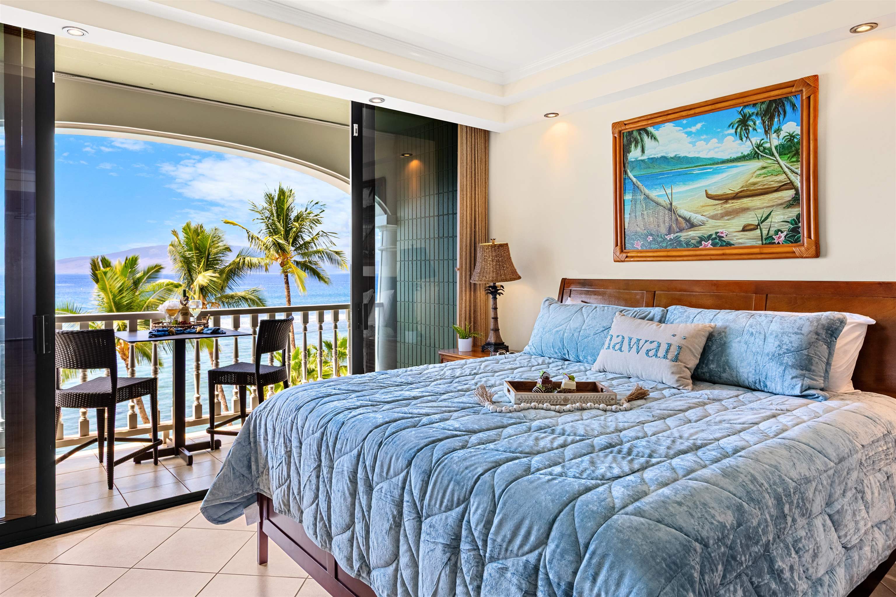 475 Front Street, Unit 635 Lahaina, HI 96761 - Photo 15 of 23 a bedroom with a bed and a painting on the wall