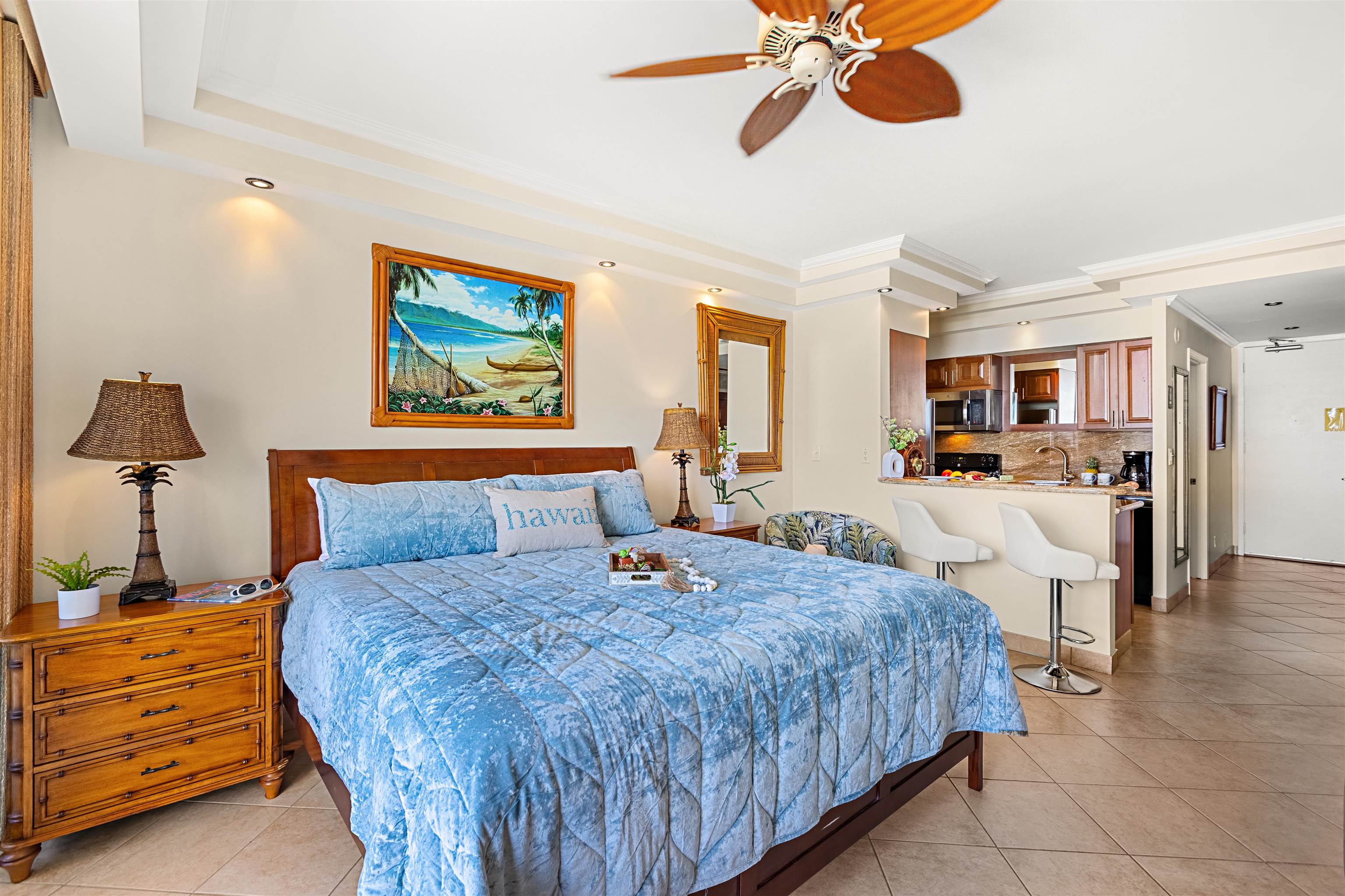 475 Front Street, Unit 635 Lahaina, HI 96761 - Photo 16 of 23 a bedroom with a bed and a chandelier
