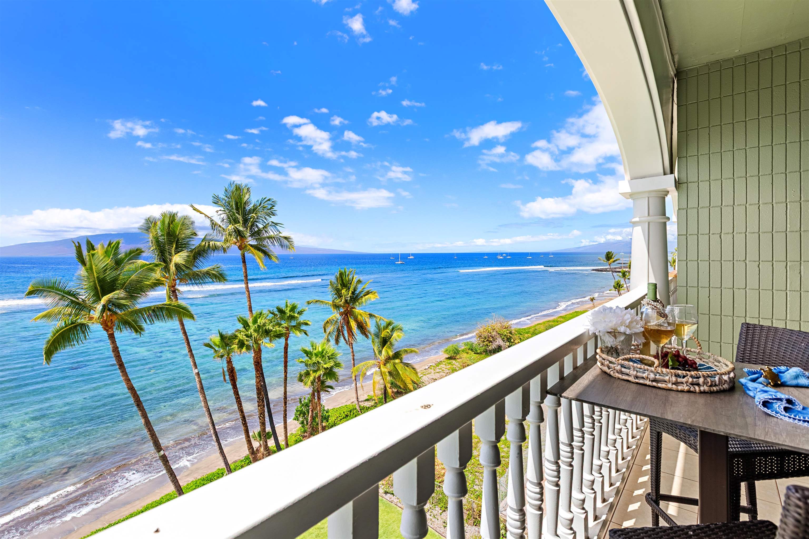 475 Front Street, Unit 635 Lahaina, HI 96761 - Photo 18 of 23 a view of a balcony with chairs and wooden floor