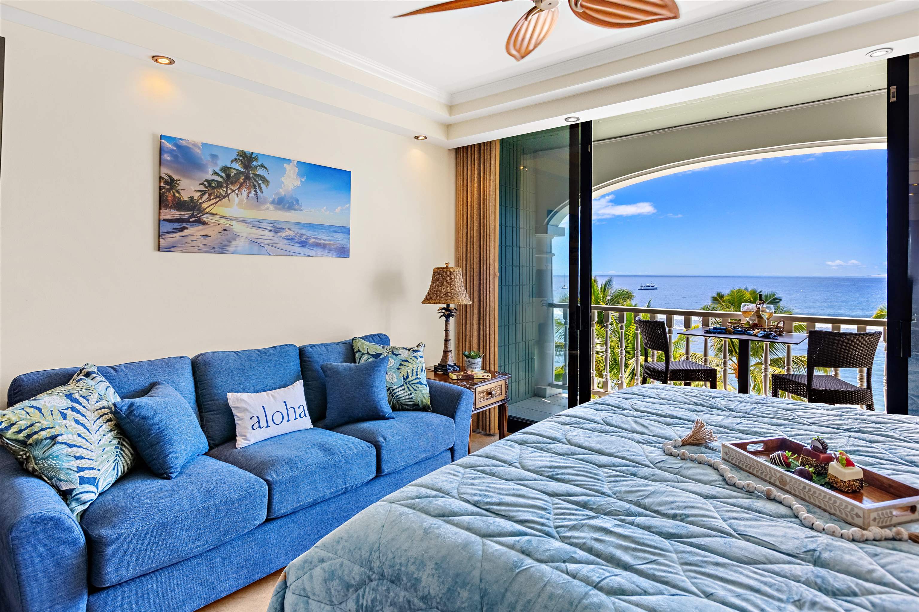 475 Front Street, Unit 635 Lahaina, HI 96761 - Photo 19 of 23 a bedroom with a large bed and a couch