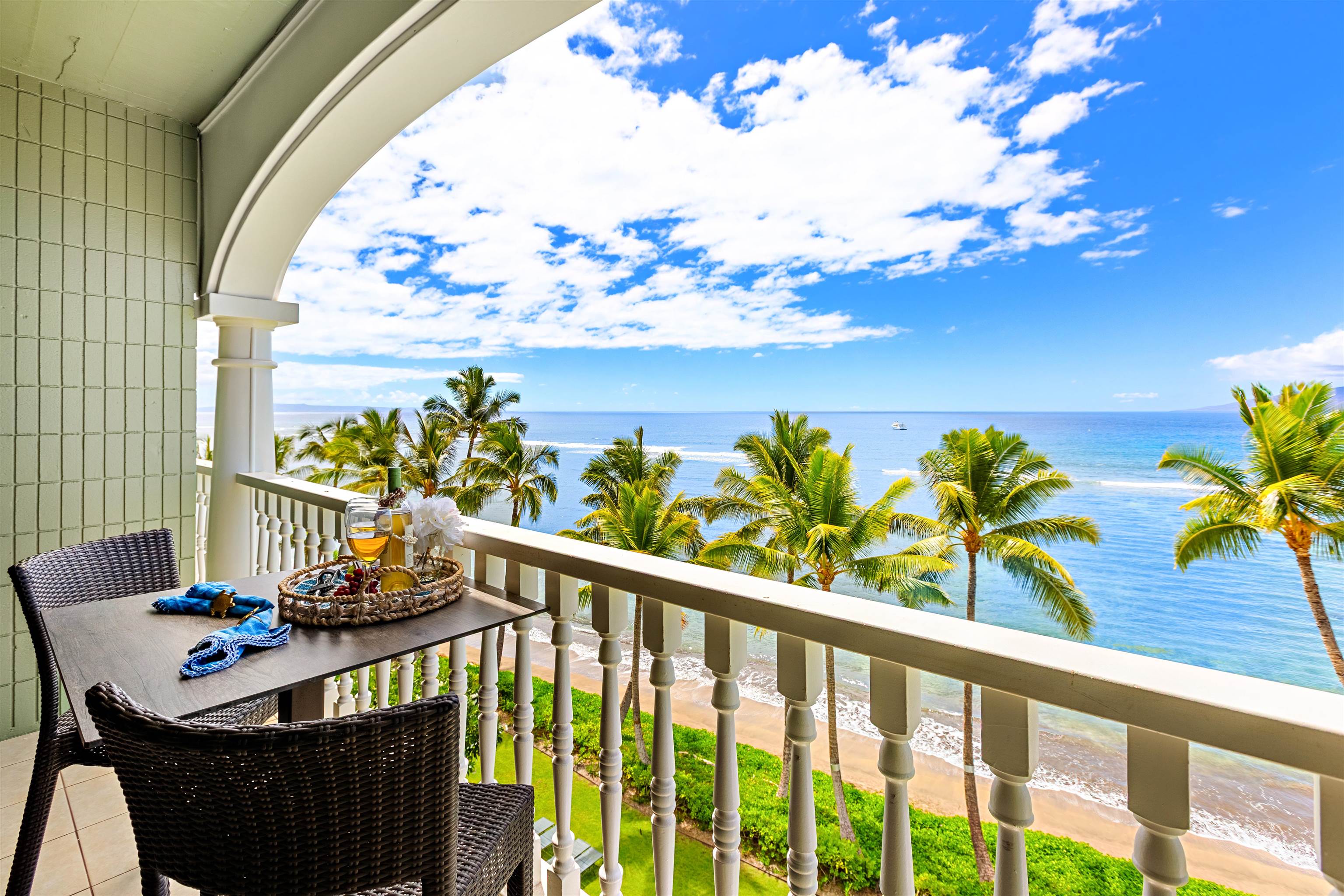 475 Front Street, Unit 635 Lahaina, HI 96761 - Photo 2 of 23 a view of a balcony dining table and chairs