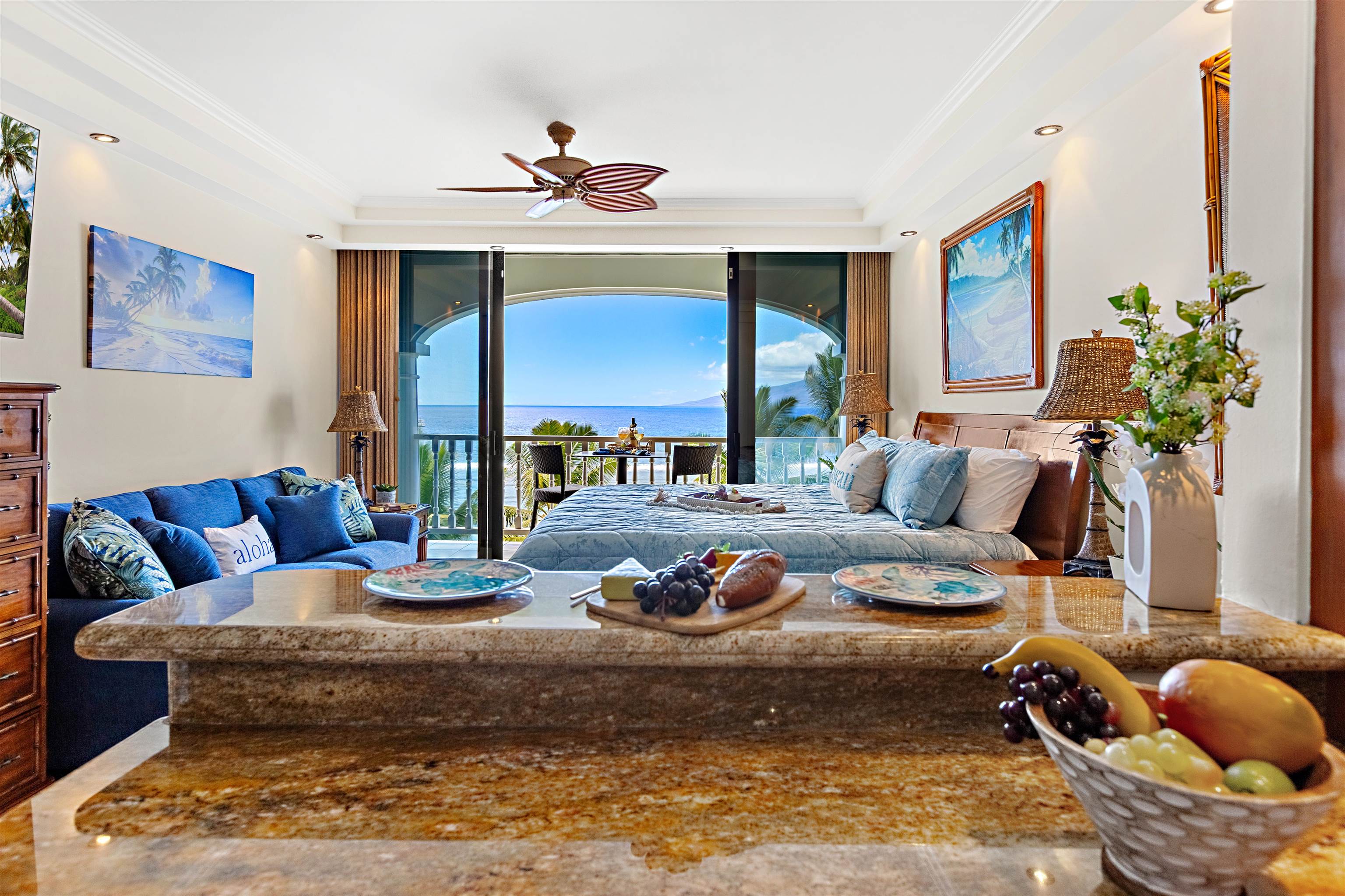 475 Front Street, Unit 635 Lahaina, HI 96761 - Photo 3 of 23 a living room with furniture ceiling fan and a rug