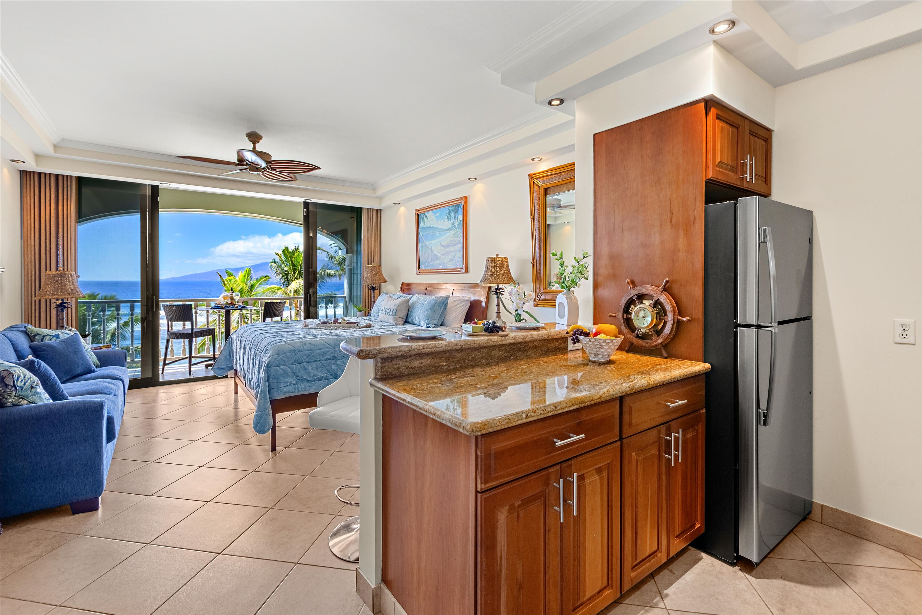 475 Front Street, Unit 635 Lahaina, HI 96761 - Photo 4 of 23 a kitchen with stainless steel appliances granite countertop a sink and a refrigerator