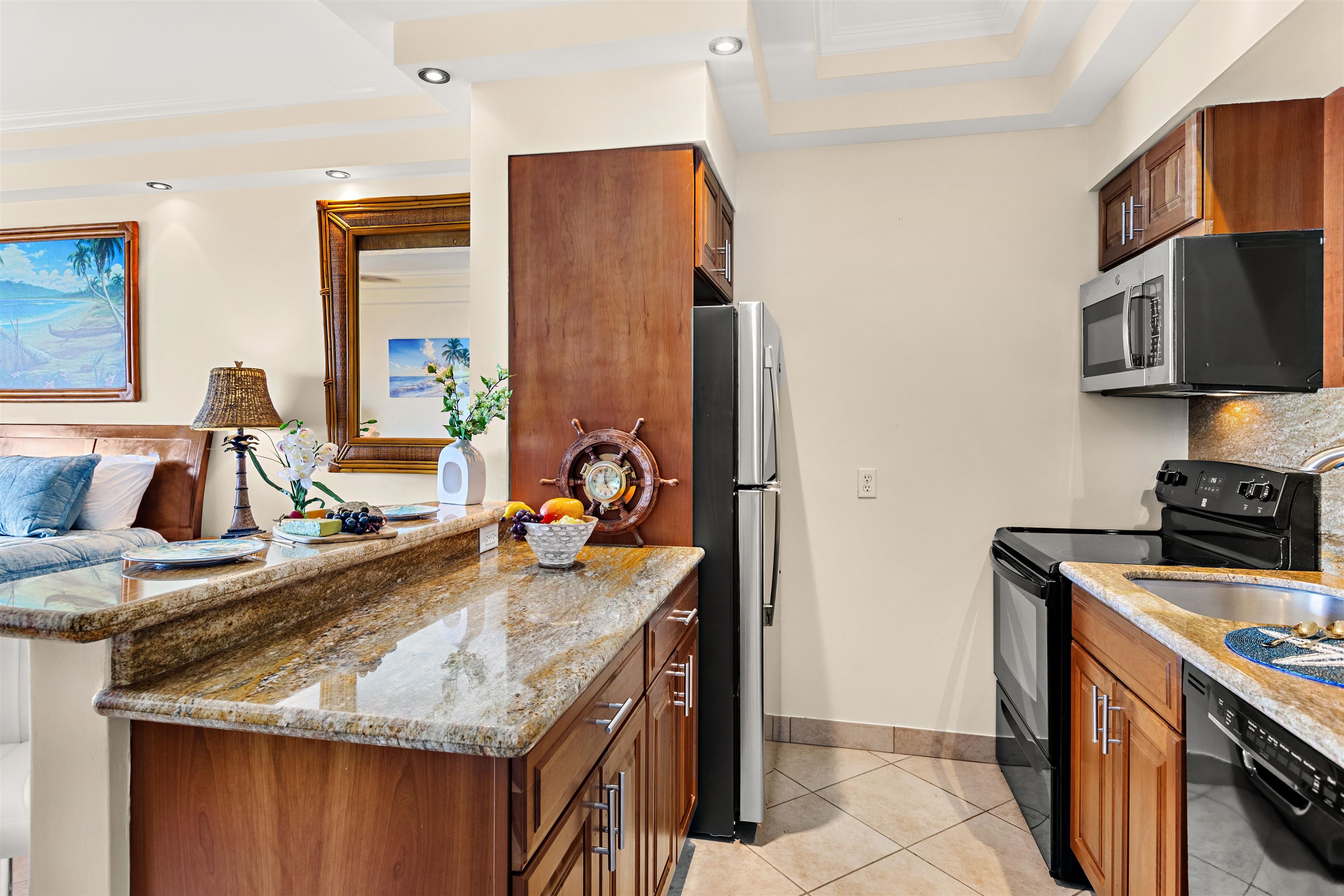 475 Front Street, Unit 635 Lahaina, HI 96761 - Photo 7 of 23 a kitchen with stainless steel appliances granite countertop a sink stove and refrigerator