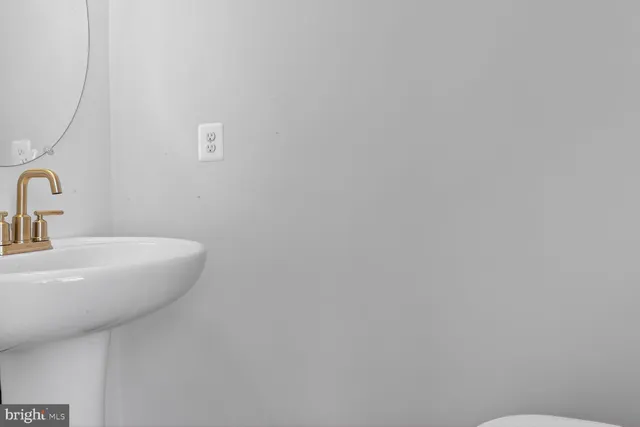 a bathroom with a sink and mirror