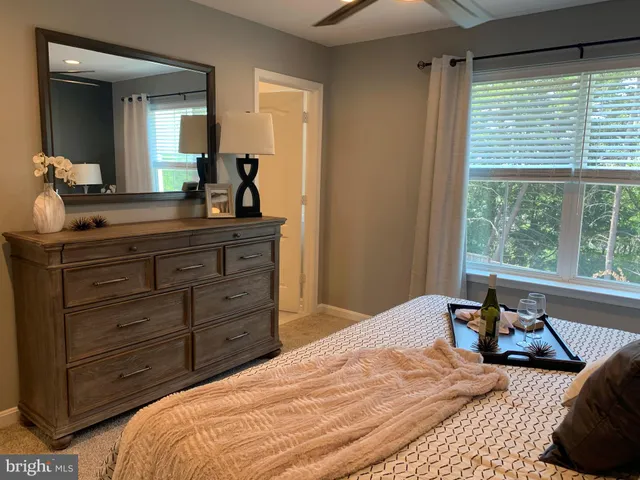 a bedroom with bed and window