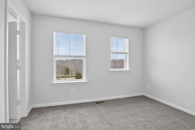 a bathroom with a sink toilet a mirror and shower