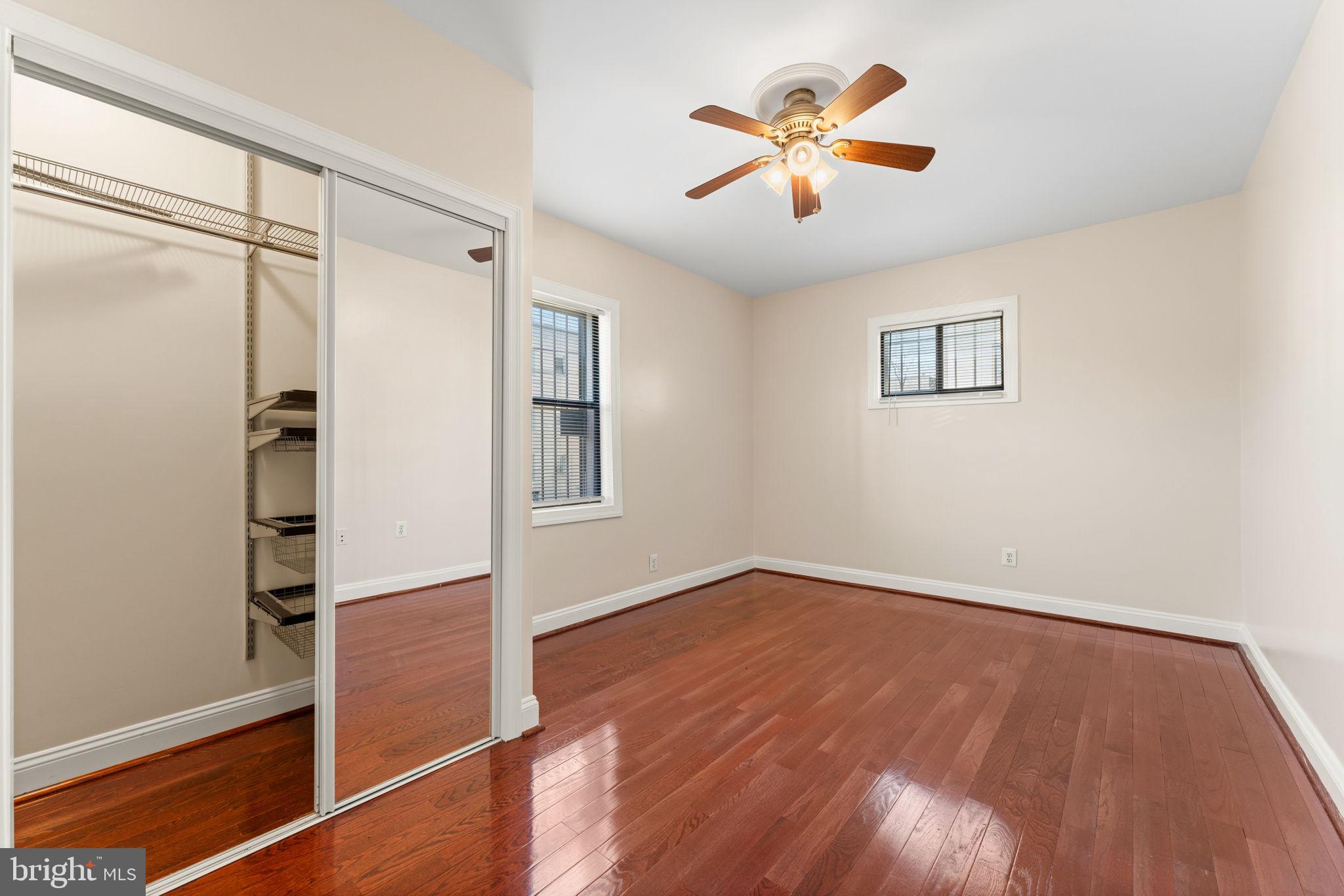315 Evarts Street Northeast, Unit T6 Washington, DC 20002 - Photo 10 of 19 wooden floor in an empty room with a window