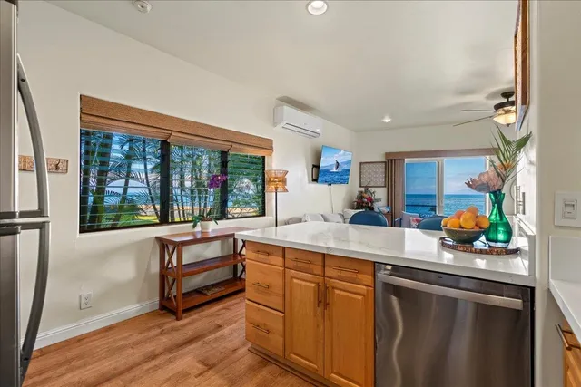 a kitchen with a sink cabinets and window