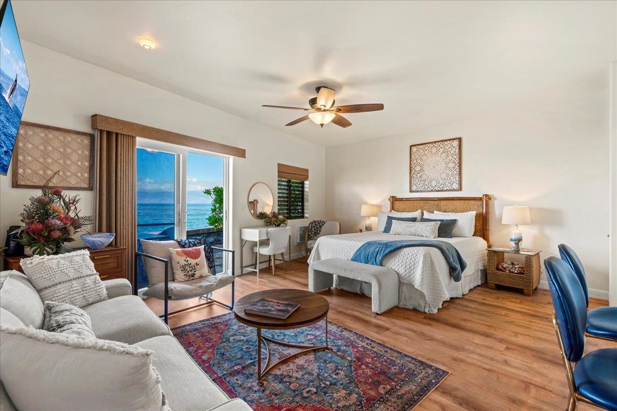4435 Lower Honoapiilani Road, Unit 103 Lahaina, HI 96761 - Photo 4 of 34 a bedroom with furniture and a rug