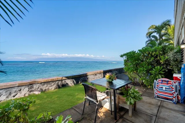 a backyard of a house with outdoor seating