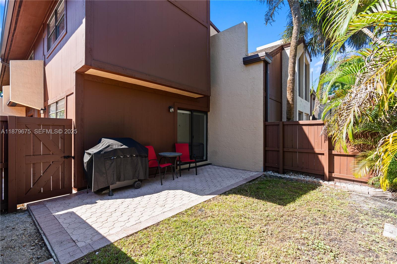 6621 Southwest 116th Place, Unit B2 Miami, FL 33173 - Photo 19 of 36 a view of a house with a patio