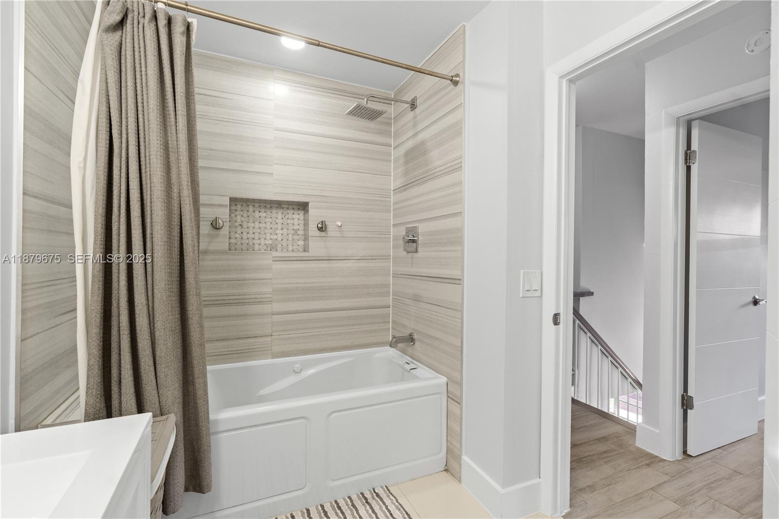 6621 Southwest 116th Place, Unit B2 Miami, FL 33173 - Photo 27 of 36 a bathroom with a bathtub and a shower