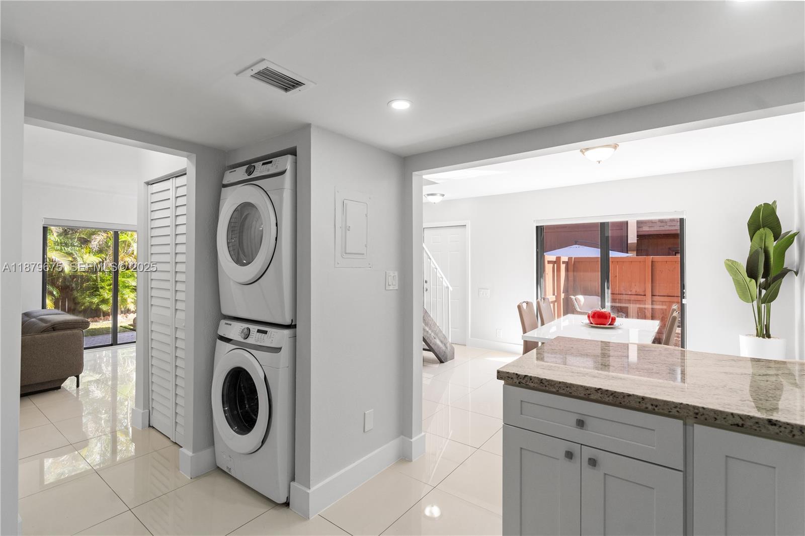 6621 Southwest 116th Place, Unit B2 Miami, FL 33173 - Photo 8 of 36 a utility room with sink dryer and washer