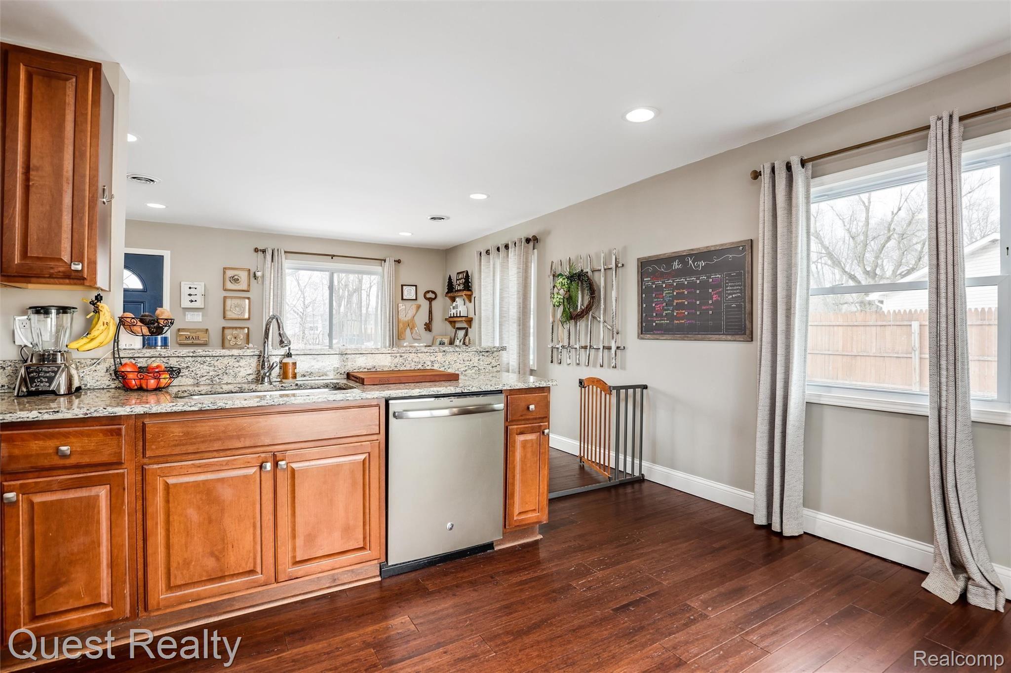 3539 Minton Road Lake Orion, MI 48359 - Photo 10 of 29 kitchen and living room with gleaming wood floors!
