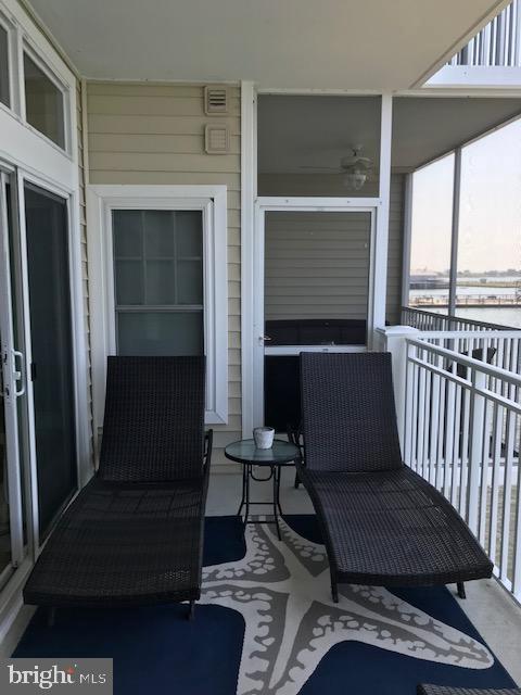 103 Williams Street, Unit 213 Crisfield, MD 21817 - Photo 11 of 25 a living room with furniture and a window