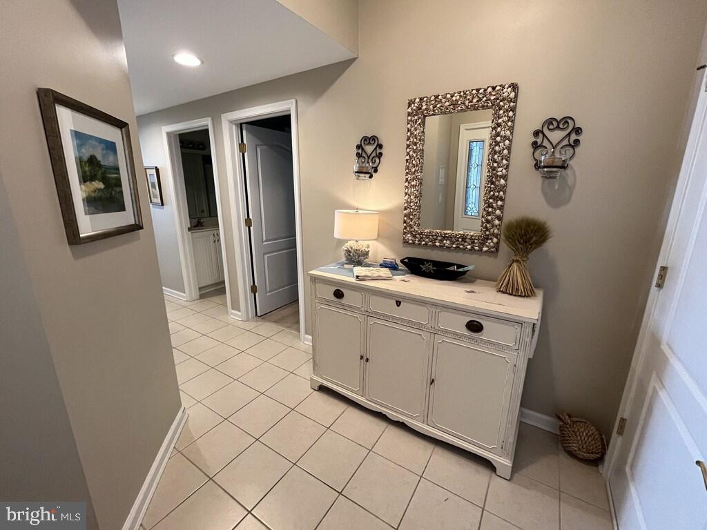 103 Williams Street, Unit 213 Crisfield, MD 21817 - Photo 12 of 25 a bathroom with a sink and a mirror