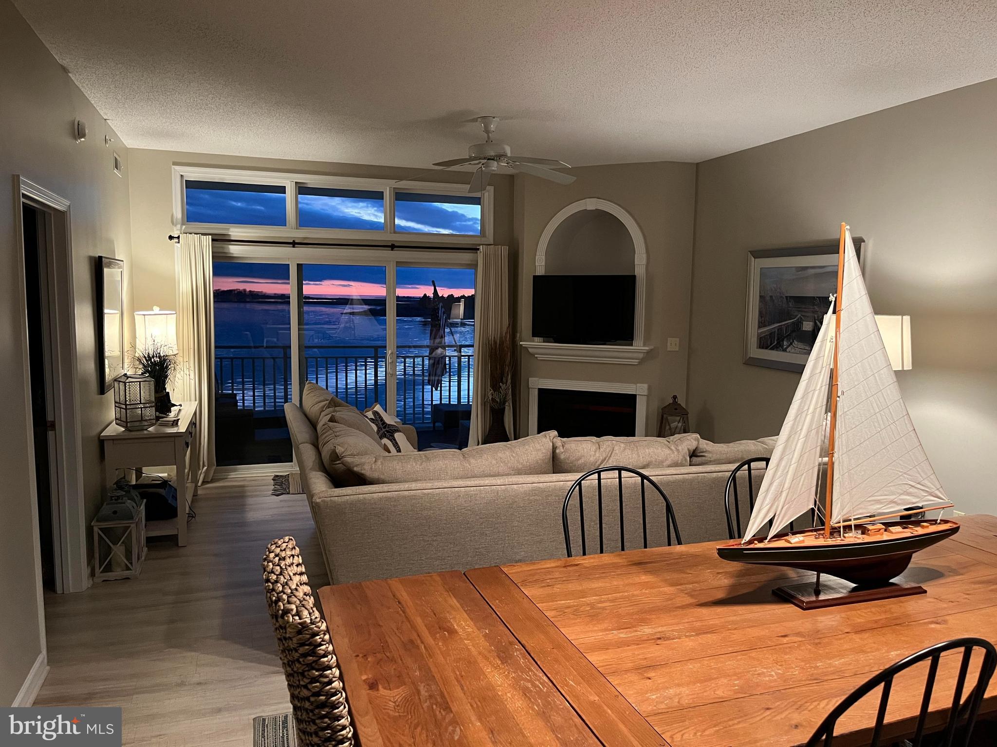 103 Williams Street, Unit 213 Crisfield, MD 21817 - Photo 14 of 25 a bedroom with a bed and a fireplace