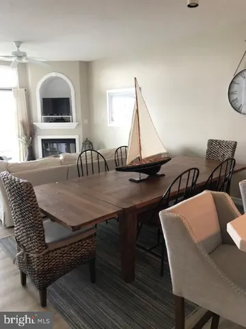 a bedroom with a bed and large mirror on the dresser