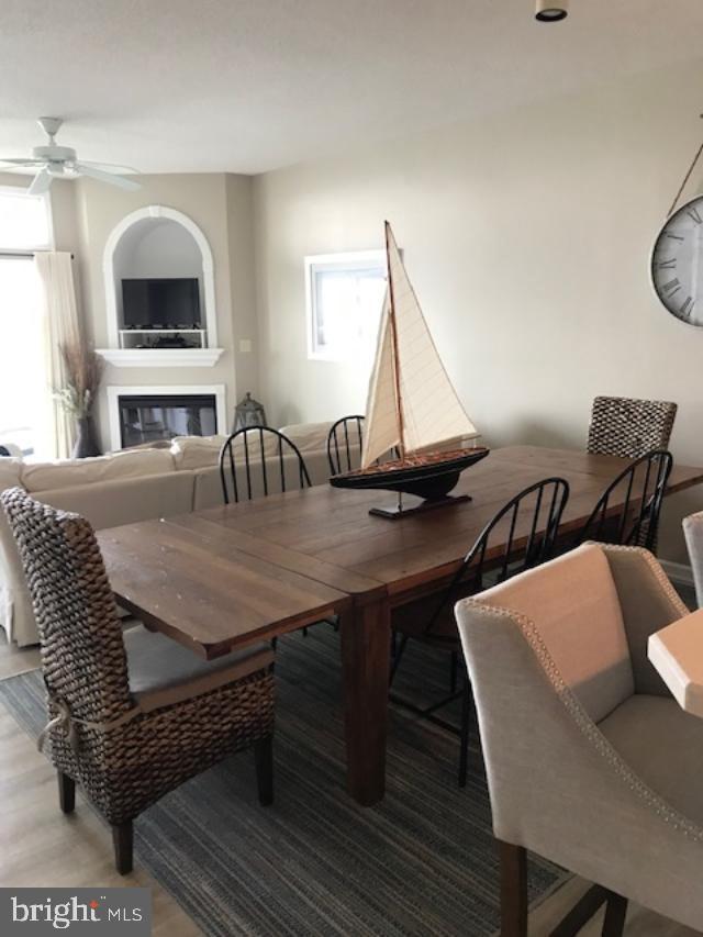 103 Williams Street, Unit 213 Crisfield, MD 21817 - Photo 15 of 25 a view of a dining room with furniture and chandelier