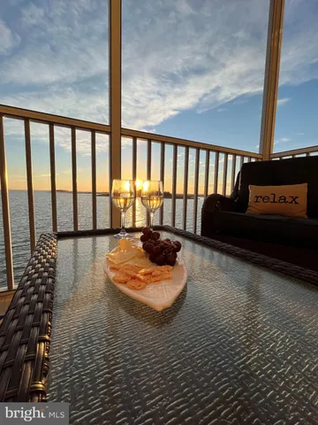 a bedroom with two beds and chandelier