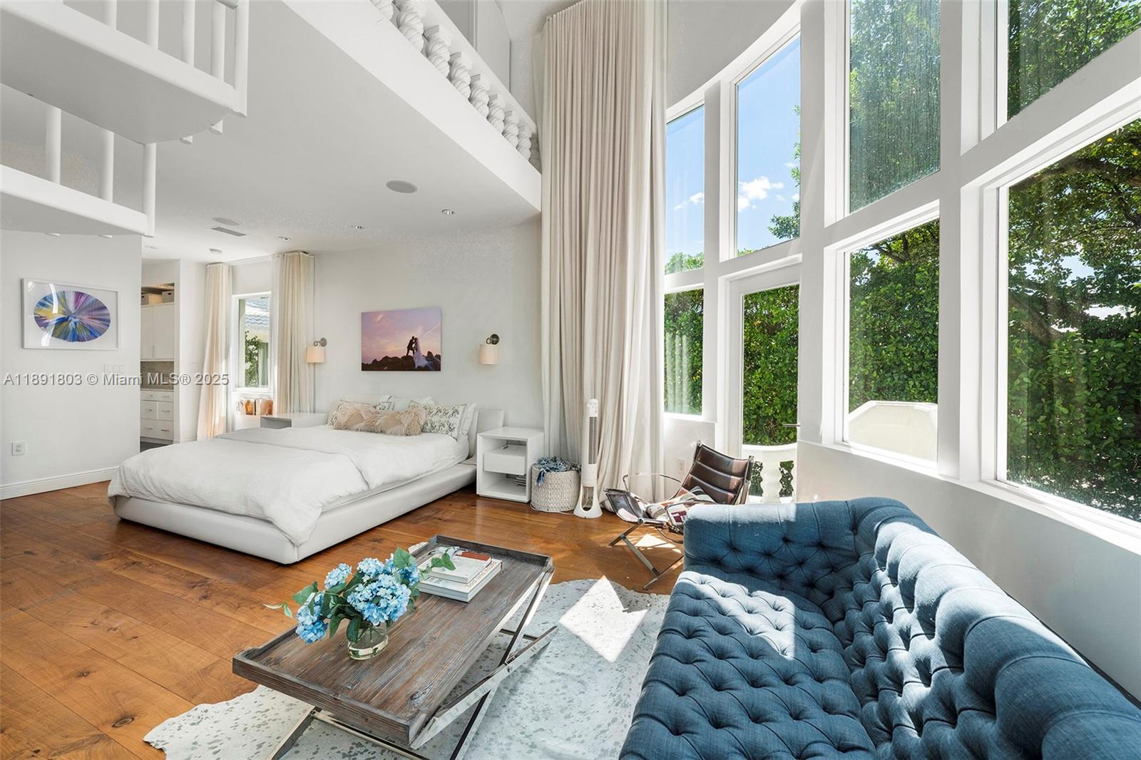 2701 North Bay Road Miami Beach, FL 33140 - Photo 21 of 38 a bedroom with furniture and a large window