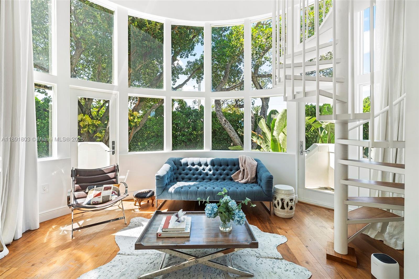 2701 North Bay Road Miami Beach, FL 33140 - Photo 22 of 38 a living room with furniture and a large window