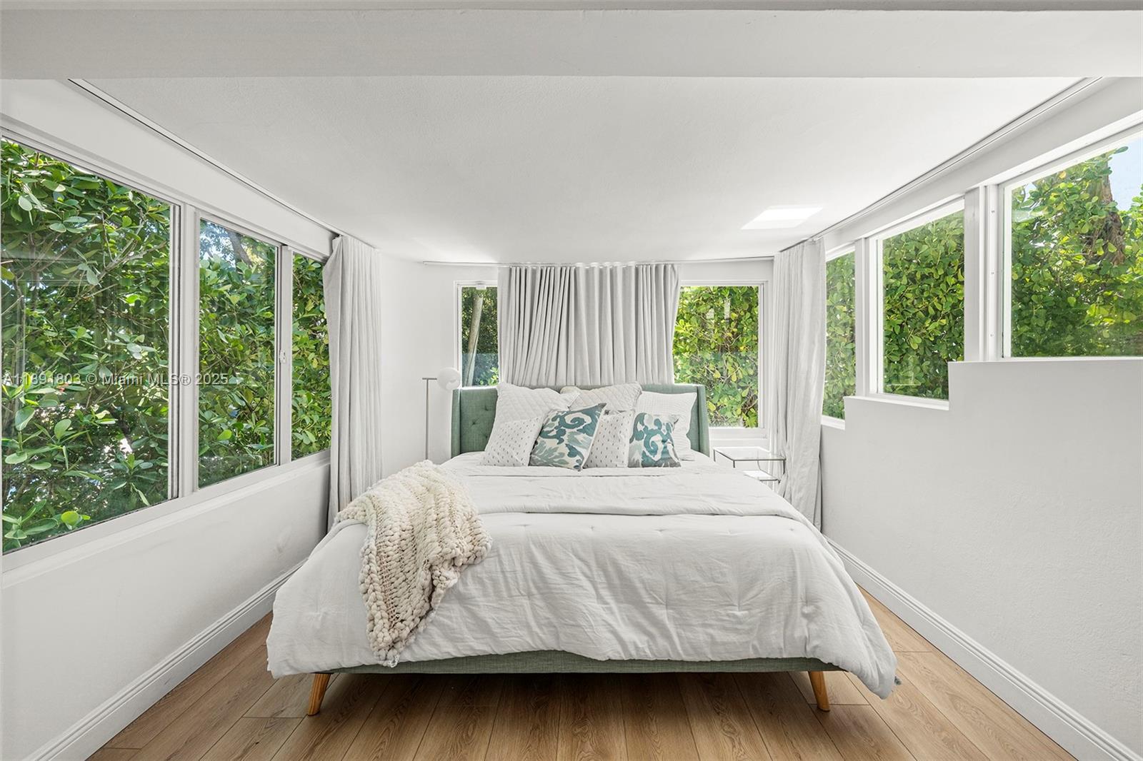 2701 North Bay Road Miami Beach, FL 33140 - Photo 31 of 38 a bedroom with a bed and a large window