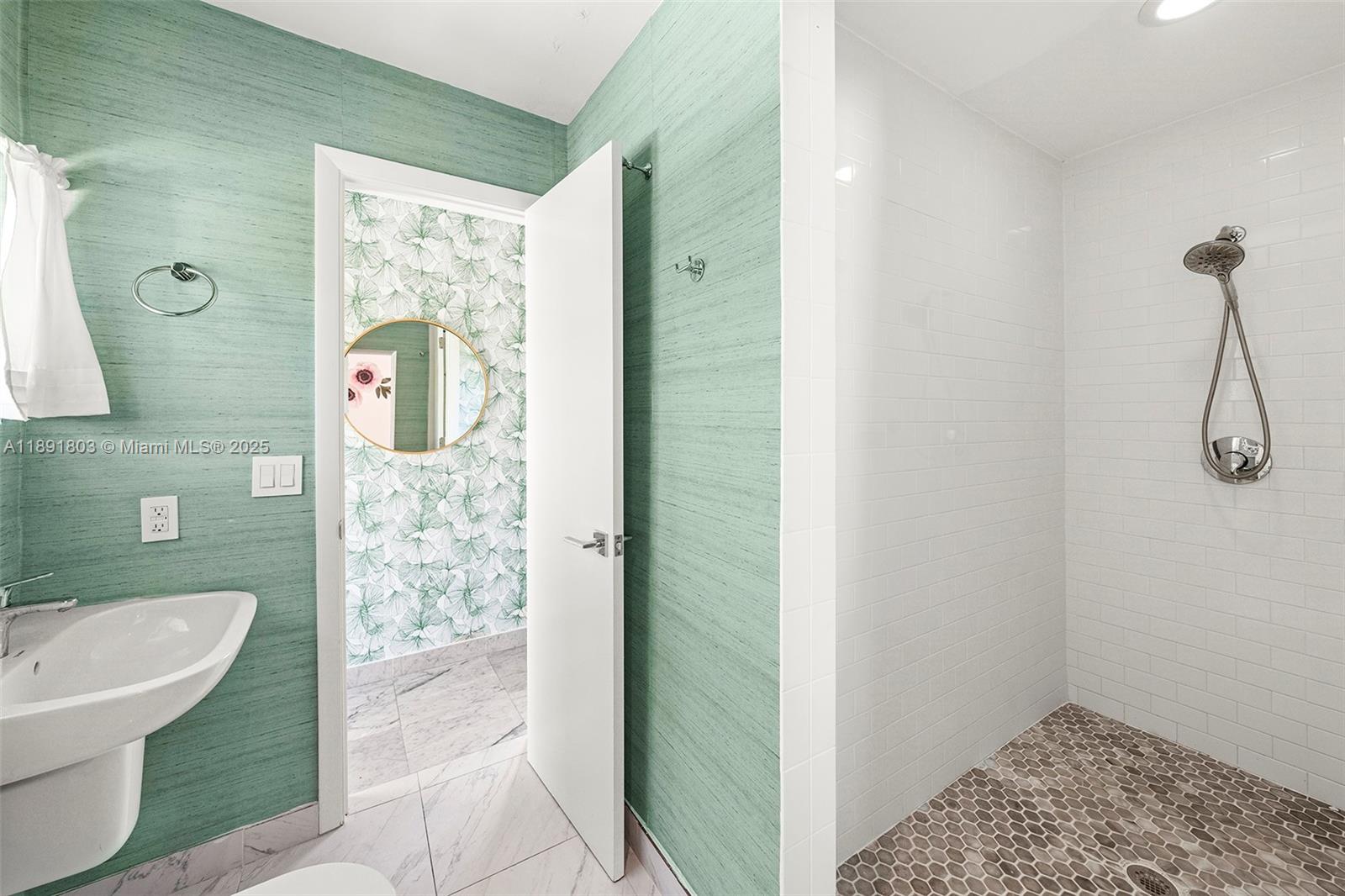 2701 North Bay Road Miami Beach, FL 33140 - Photo 33 of 38 a bathroom with a sink a toilet and shower