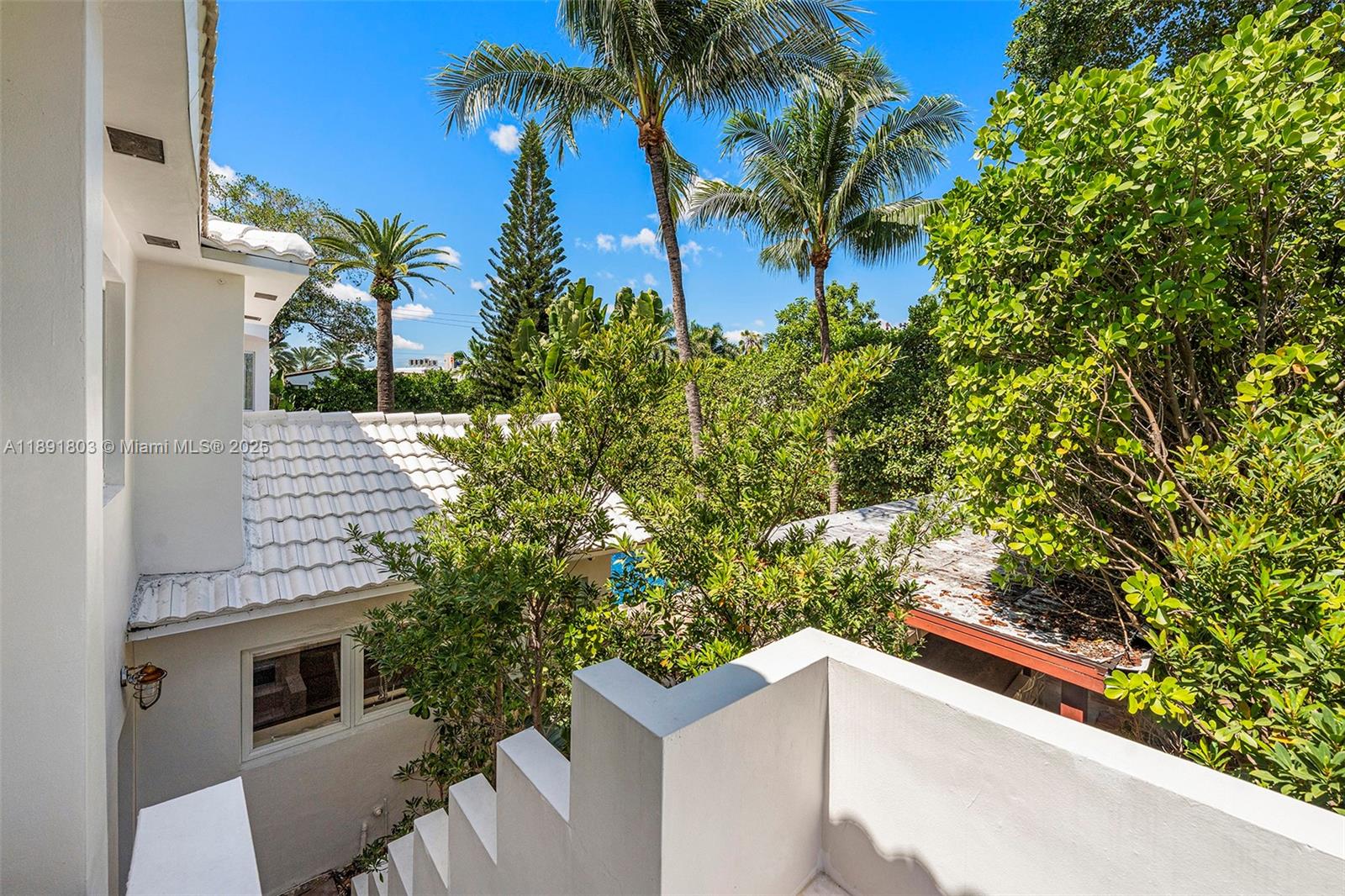 2701 North Bay Road Miami Beach, FL 33140 - Photo 35 of 38 a view of a house with a yard