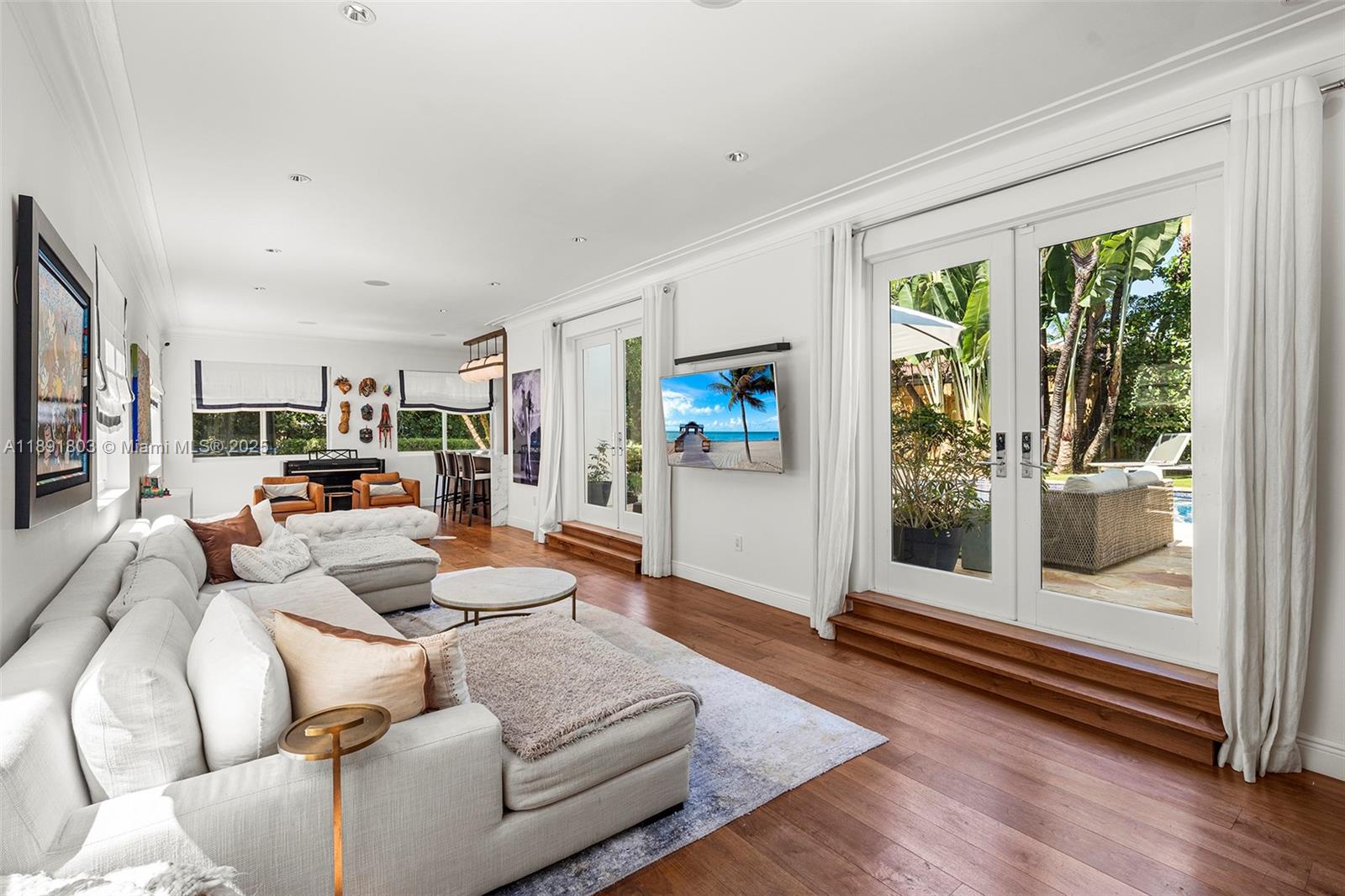 2701 North Bay Road Miami Beach, FL 33140 - Photo 7 of 38 a living room with furniture and a window