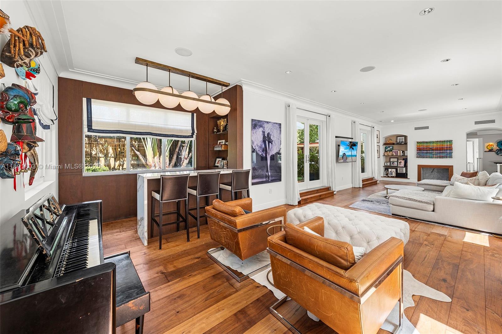 2701 North Bay Road Miami Beach, FL 33140 - Photo 9 of 38 a living room with furniture fireplace and a window