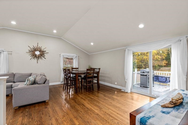 242 Hedges Pond Road Plymouth, MA 02360 - Photo 13 of 38 a living room with furniture and a wooden floor