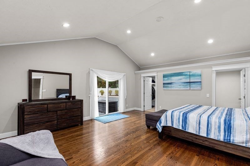 242 Hedges Pond Road Plymouth, MA 02360 - Photo 15 of 38 a bedroom with a bed and dresser with mirror