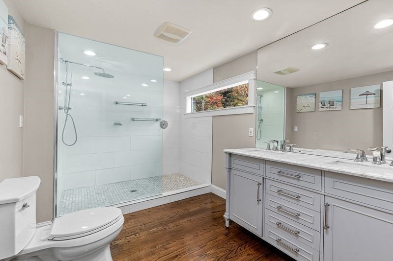 242 Hedges Pond Road Plymouth, MA 02360 - Photo 17 of 38 a bathroom with a granite countertop sink toilet and shower