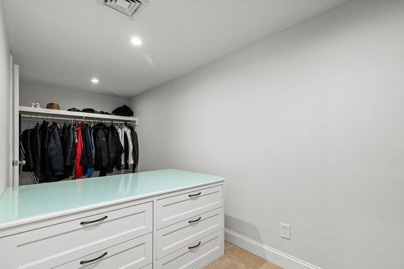 242 Hedges Pond Road Plymouth, MA 02360 - Photo 19 of 38 a view of walk in closet with clothes and shoes