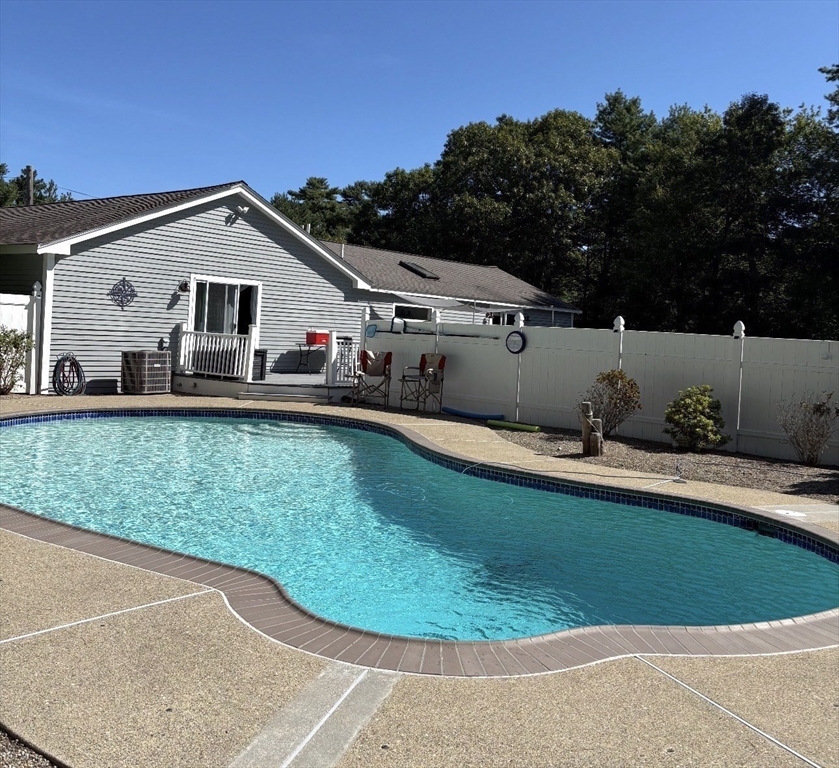 242 Hedges Pond Road Plymouth, MA 02360 - Photo 2 of 38 a front view of a house with a yard and trees