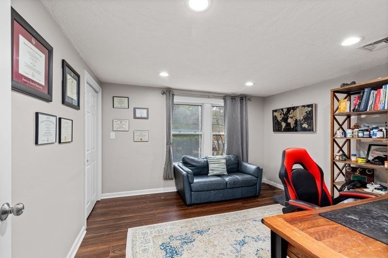 242 Hedges Pond Road Plymouth, MA 02360 - Photo 21 of 38 a living room with furniture a rug and a window