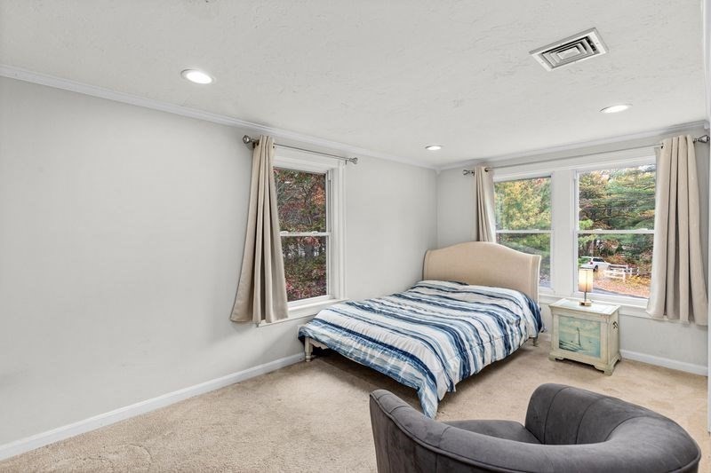 242 Hedges Pond Road Plymouth, MA 02360 - Photo 22 of 38 a bedroom with a bed and a large window